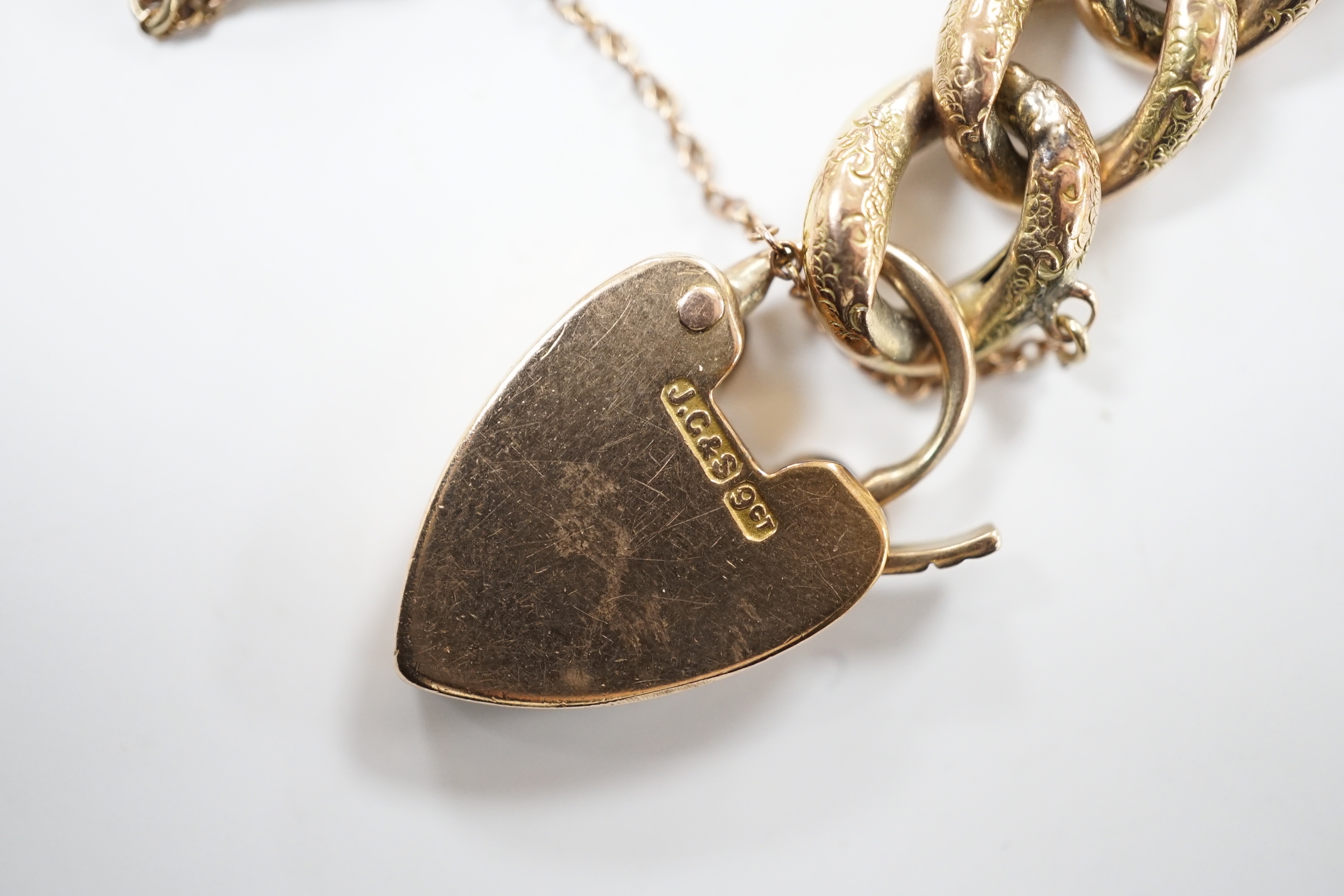 A 9ct curblink bracelet, with padlock clasp, 19cm, 22.6 grams and a 19th century brooch(a.f.)
